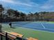 Beautifully maintained tennis courts feature green and blue surfacing, lighting, and plenty of room for spectator seating at 2837 Captain Ct, Dacula, GA 30019