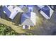 An aerial view shows a home with a dark gray roof and a landscaped yard at 3309 Gardenside Walk, Loganville, GA 30052