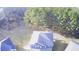 An aerial shot shows a large roof and mature trees at 3309 Gardenside Walk, Loganville, GA 30052