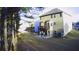 The backyard features a deck, patio, lush lawn, and mature trees at 3309 Gardenside Walk, Loganville, GA 30052