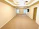 Spacious bedroom featuring a tray ceiling and ample natural light at 3309 Gardenside Walk, Loganville, GA 30052