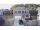Charming two-story brick home with a covered front porch at 3309 Gardenside Walk, Loganville, GA 30052