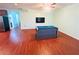 Open game room with pool table and laminate wood flooring for entertainment at 3309 Gardenside Walk, Loganville, GA 30052