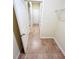 The hallway has tiled floors, white trim, and an open door at 3309 Gardenside Walk, Loganville, GA 30052