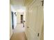 Hallway with carpet and neutral paint leading to other rooms in the house at 3309 Gardenside Walk, Loganville, GA 30052