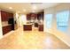 Modern kitchen featuring stainless steel appliances, granite countertops, a kitchen island and ample cabinet space at 3309 Gardenside Walk, Loganville, GA 30052