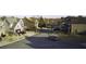 Neighborhood street view with well-maintained homes and parked cars at 3309 Gardenside Walk, Loganville, GA 30052
