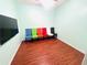 Multipurpose room featuring an accent wall with a variety of colorful chairs at 3309 Gardenside Walk, Loganville, GA 30052