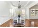 Dining room with white walls and a modern table and chairs at 1399 Legrand Cir, Lawrenceville, GA 30043