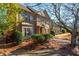 Brick home featuring manicured landscaping, mulched flower beds, and a sidewalk at 1399 Legrand Cir, Lawrenceville, GA 30043