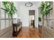 Elegant foyer with hardwood floors, wreaths and a decorative console table at 1399 Legrand Cir, Lawrenceville, GA 30043