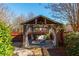 Backyard gazebo with seating, surrounded by lush landscaping at 1399 Legrand Cir, Lawrenceville, GA 30043