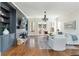 Cozy living room with a fireplace, built-in shelves, and large windows for natural light at 1399 Legrand Cir, Lawrenceville, GA 30043