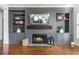 Living room fireplace with shelving at 1399 Legrand Cir, Lawrenceville, GA 30043