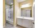 Bathroom displaying a bathtub with shower, vanity, and a bright overhead light at 1404 Haven Cir, Douglasville, GA 30135