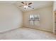 Bedroom showcasing a vaulted ceiling, ceiling fan, and a large window with natural light at 1404 Haven Cir, Douglasville, GA 30135