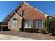 Attractive single-story home featuring brick and stone accents, complemented by manicured greenery at 1404 Haven Cir, Douglasville, GA 30135