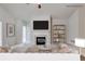 Digitally staged living room with a fireplace and decorative shelving at 1404 Haven Cir, Douglasville, GA 30135