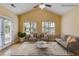 Bright, staged living room showcases a neutral color palette and comfortable seating arrangement at 1404 Haven Cir, Douglasville, GA 30135