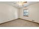 Neutral bedroom with a ceiling fan and a large window at 1465 Rockbridge Rd, Stone Mountain, GA 30087