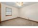 Bedroom featuring neutral carpet, ceiling fan and natural light from a window at 1465 Rockbridge Rd, Stone Mountain, GA 30087