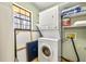 Efficient laundry room setup with stacked washer and dryer at 1465 Rockbridge Rd, Stone Mountain, GA 30087