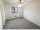 Clean bedroom featuring neutral walls, carpet floors, and a window with natural light at 2658 Kellogg Creek Rd, Acworth, GA 30102