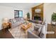 Cozy living room featuring a stone fireplace, large window and comfortable seating at 2658 Kellogg Creek Rd, Acworth, GA 30102