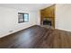 Open-concept living room with hardwood floors and a beautiful stone fireplace at 2658 Kellogg Creek Rd, Acworth, GA 30102