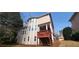 Well-maintained two-story house with a deck and a nicely landscaped backyard at 3302 Fieldwood Se Dr, Smyrna, GA 30080