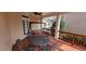 Inviting covered porch with a ceiling fan, table and chair set, and porch swing, perfect for outdoor enjoyment at 3302 Fieldwood Se Dr, Smyrna, GA 30080