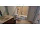 Bathroom features a shower-tub combo and vanity with wooden cabinets, offering essential amenities in a functional design at 3302 Fieldwood Se Dr, Smyrna, GA 30080