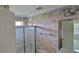 This bathroom has a shower with patterned wallpaper and tile floor at 3302 Fieldwood Se Dr, Smyrna, GA 30080