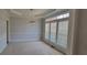 Elegant dining room with coffered ceilings, plantation shutters and carpet flooring at 3302 Fieldwood Se Dr, Smyrna, GA 30080