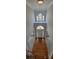 Grand foyer with high ceilings, wood floors, and a modern chandelier, offering a bright and welcoming entrance at 3302 Fieldwood Se Dr, Smyrna, GA 30080
