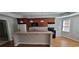 Charming kitchen with wood cabinets, a breakfast bar, and modern appliances at 3302 Fieldwood Se Dr, Smyrna, GA 30080