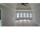 Spacious main bedroom features a ceiling fan, neutral colors, and a wall of windows with bright, natural light at 3302 Fieldwood Se Dr, Smyrna, GA 30080