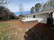 View of the backyard featuring a brick patio on a bright sunny day with lots of natural light at 3576 Pinehill Cir, Acworth, GA 30101