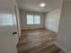 Cozy bedroom with hardwood floors, natural light from the windows, and ample closet space at 3576 Pinehill Cir, Acworth, GA 30101