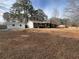 Exterior elevation of a beautiful brick home with an accessory building on a sunny day at 3576 Pinehill Cir, Acworth, GA 30101