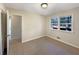 Bright bedroom with neutral walls, carpet flooring, closet, and natural light from a window at 4227 Pine Cir, Forest Park, GA 30297