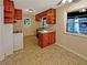 Bright kitchen with ample counter space, knotty pine cabinetry, and natural light at 4227 Pine Cir, Forest Park, GA 30297