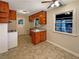 Bright kitchen with ample counter space, knotty pine cabinetry, and natural light at 4227 Pine Cir, Forest Park, GA 30297