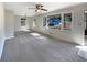 Spacious living room featuring neutral walls, plush carpet, and multiple windows for natural light at 4227 Pine Cir, Forest Park, GA 30297