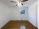 Clean, empty bedroom featuring hardwood floors and a bright window at 1376 Cornwall Rd, Decatur, GA 30032