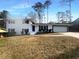 Charming two-story home featuring a white exterior, attached garage, and well-maintained lawn at 1376 Cornwall Rd, Decatur, GA 30032