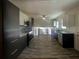 Modern kitchen with stainless steel appliances, sleek cabinetry, and stylish tile flooring at 1376 Cornwall Rd, Decatur, GA 30032