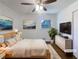 Bedroom featuring hardwood floors, a comfortable bed, and soft, neutral decor at 1376 Cornwall Rd, Decatur, GA 30032