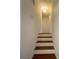 Bright stairway with wood steps and white risers leads to the upper level of the home at 1376 Cornwall Rd, Decatur, GA 30032