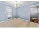 Bright dining room featuring hardwood floors, a modern chandelier, and a door leading to the deck at 1717 Ramblewood Way, Snellville, GA 30078